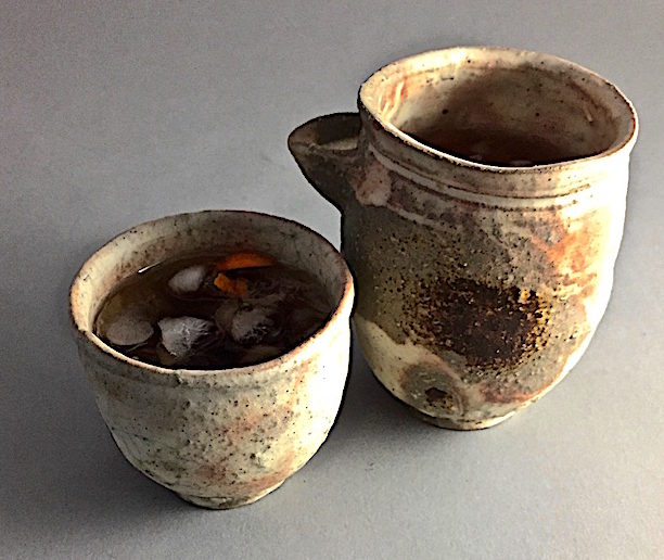 An equal parts Manhattan Wood fired Shigaraki cup and pourer by Kenzo Ozawa