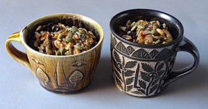 Pumpkin pudding with nuts, seeds and currants Carved mugs by Matthew Metz