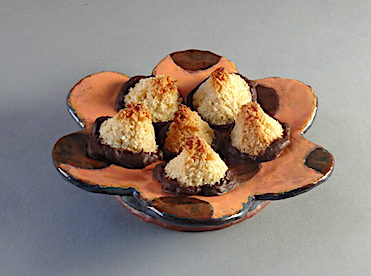 Chocolate dipped coconut haystacks Earthenware flower plate by Holly Walker