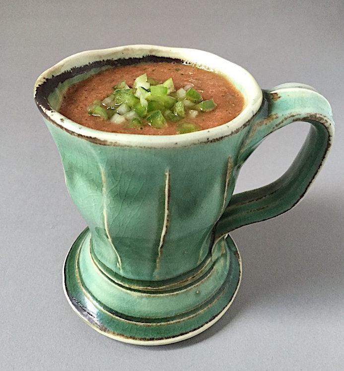 Summer Gazpacho with chopped cucumber, green pepper and jalapeño Soda-fired mug by Gertrude Graham Smith